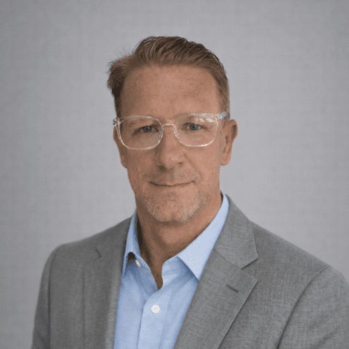 Middle-aged man in glasses and suit