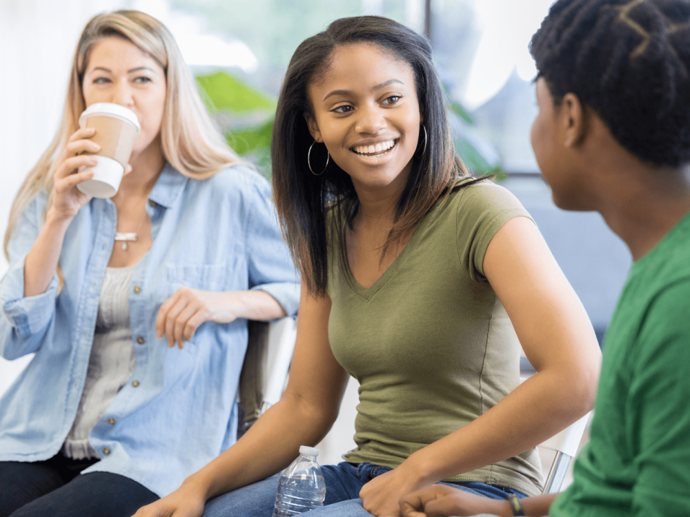 A group of young adults enjoying a friendly conversation.
